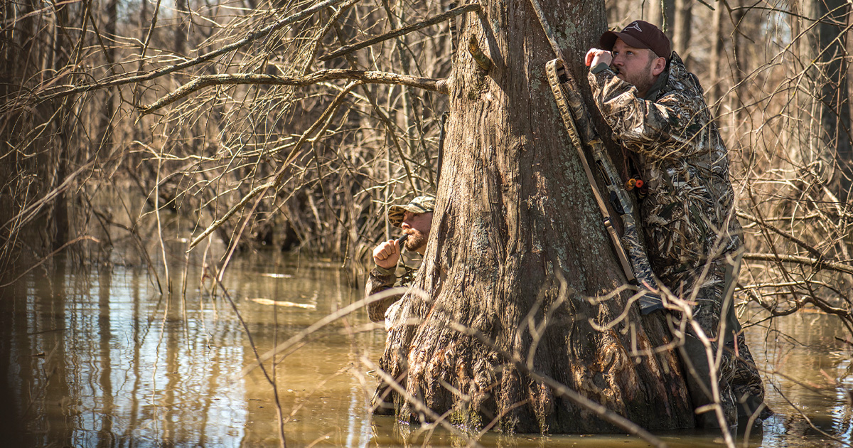 Waterfowl hunters in flooded timber. Photo by BillKonway.com