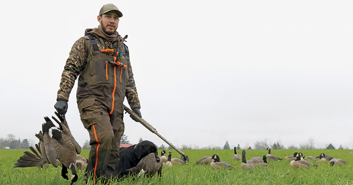 Goose hunter with harvested geese. Photo by garykramer.net