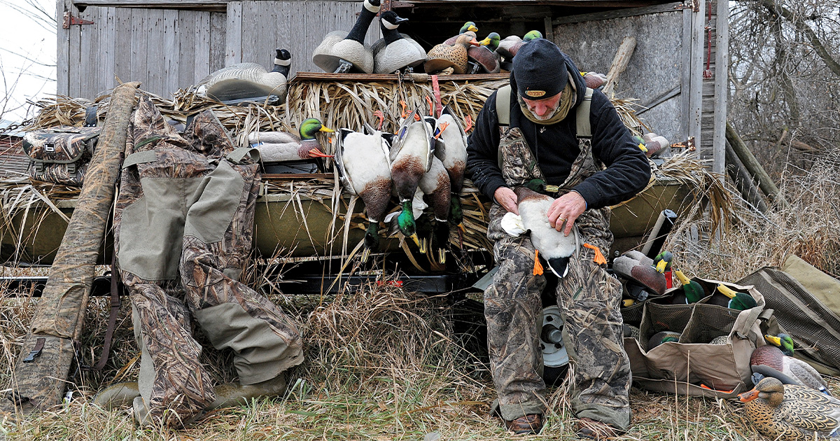 Hunter cleaning waterfowl. Photo by Jim Thompson