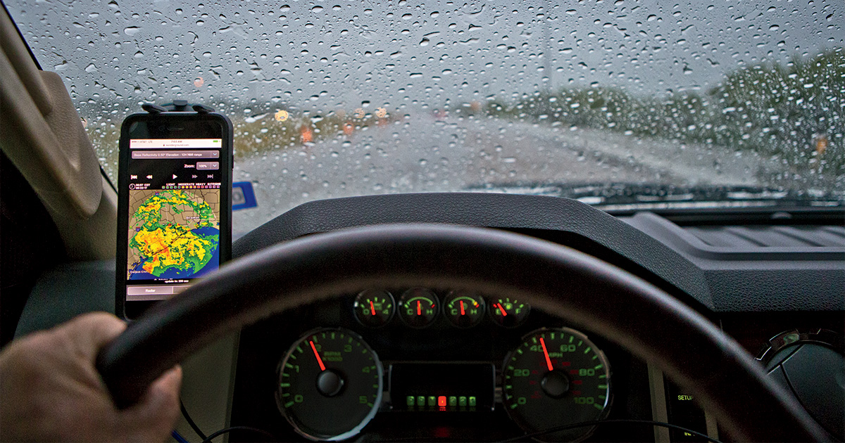 Weather map open on phone while in truck. Photo by ToddSteelePhotoArt.com