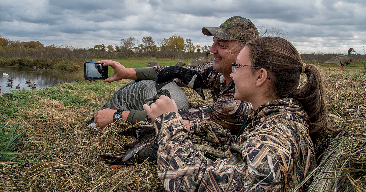 Duck hunters celebrating a successful hunt. Photo by Chase Ryan_Drake Waterfowl.jpg