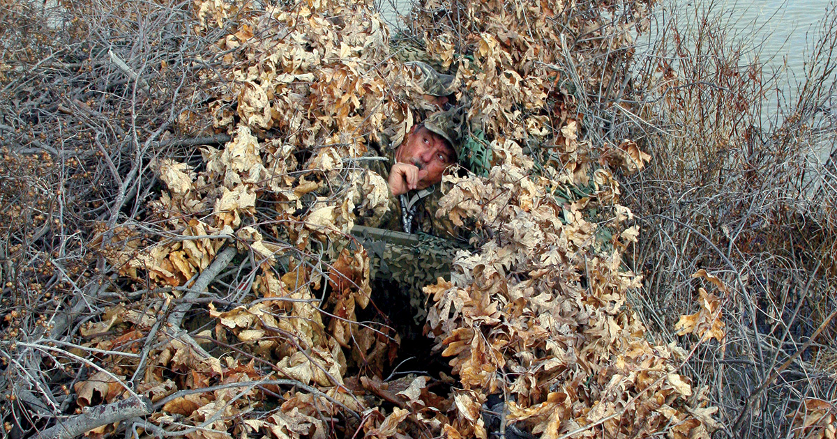 Layers of camouflage conceal the author in his blind along the Mississippi River in western Kentucky. Photo by John Hoffman, DU